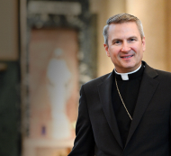 Square image of Bishop Hicks standing to the right