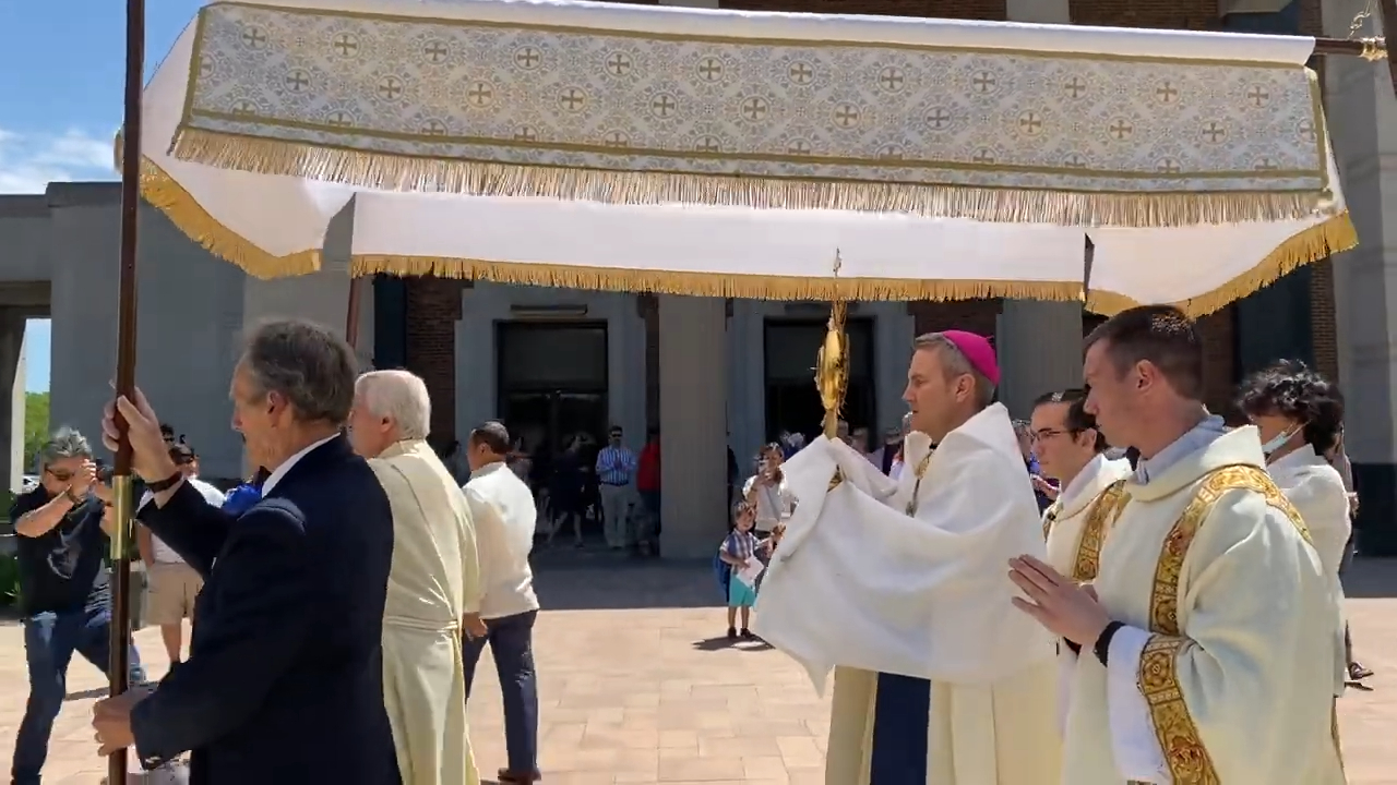 Bishop Hicks holding a monstrance